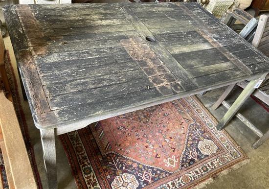 A weathered teak garden table, width 150cm, depth 90cm